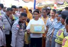Sambut-HUT-Bhayangkara,-Polresta-Kupang-Kota-Bagikan-Sembako-Kepada-Warga-Kota-Kupang
